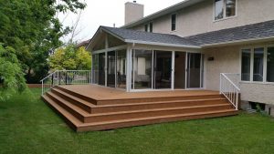 Gable sunroom and custom deck with stadium stairs