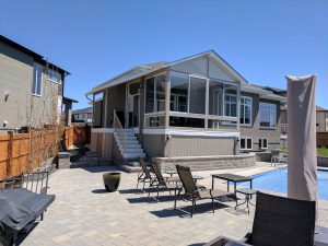 Integrated covered balcony with an extension gable to keep the roof lines congruent