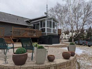 Life on the farm in Manitoba is good. but, adding a sunroom to it is even better