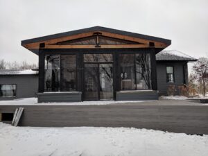 Black curtain walls are great on dark grey homes